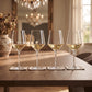 Set of 4 white wine glasses, 14 oz, featuring a modern design and clear glass construction for serving white wine at dinners, gatherings, and special occasions.
