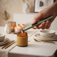 Metallic green flameless lighter with plasma arc technology, USB rechargeable design, and long stem for convenient candle and fireplace lighting.

