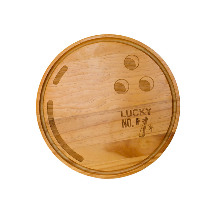 Pine wood bowling ball board measuring approximately 13 inches in diameter, featuring realistic grip holes and a “Lucky No. 7” detail, perfect for serving snacks or charcuterie at sports-themed gatherings.