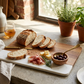 White marble and acacia wood rectangle serving board, 11.75 x 8 inches, with a modern design for serving cheese, charcuterie, appetizers, and snacks.