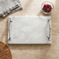 White marble serving board with silver branch handles, 8-inch by 12-inch, ideal for serving cheese, fruit, and appetizers.