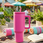 Stainless steel 40 oz hot pink tumbler with handle, removable straw, and modern insulated design.