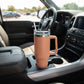 Clay 40 oz stainless steel tumbler with handle and straw, featuring an insulated design for keeping drinks hot or cold on the go.

