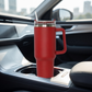 Red 40 oz stainless steel tumbler with handle and straw