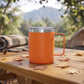 Orange 12 oz stainless steel travel mug with handle, vacuum insulation, and leak-proof push-pull lid for hot or cold drinks on the go.
