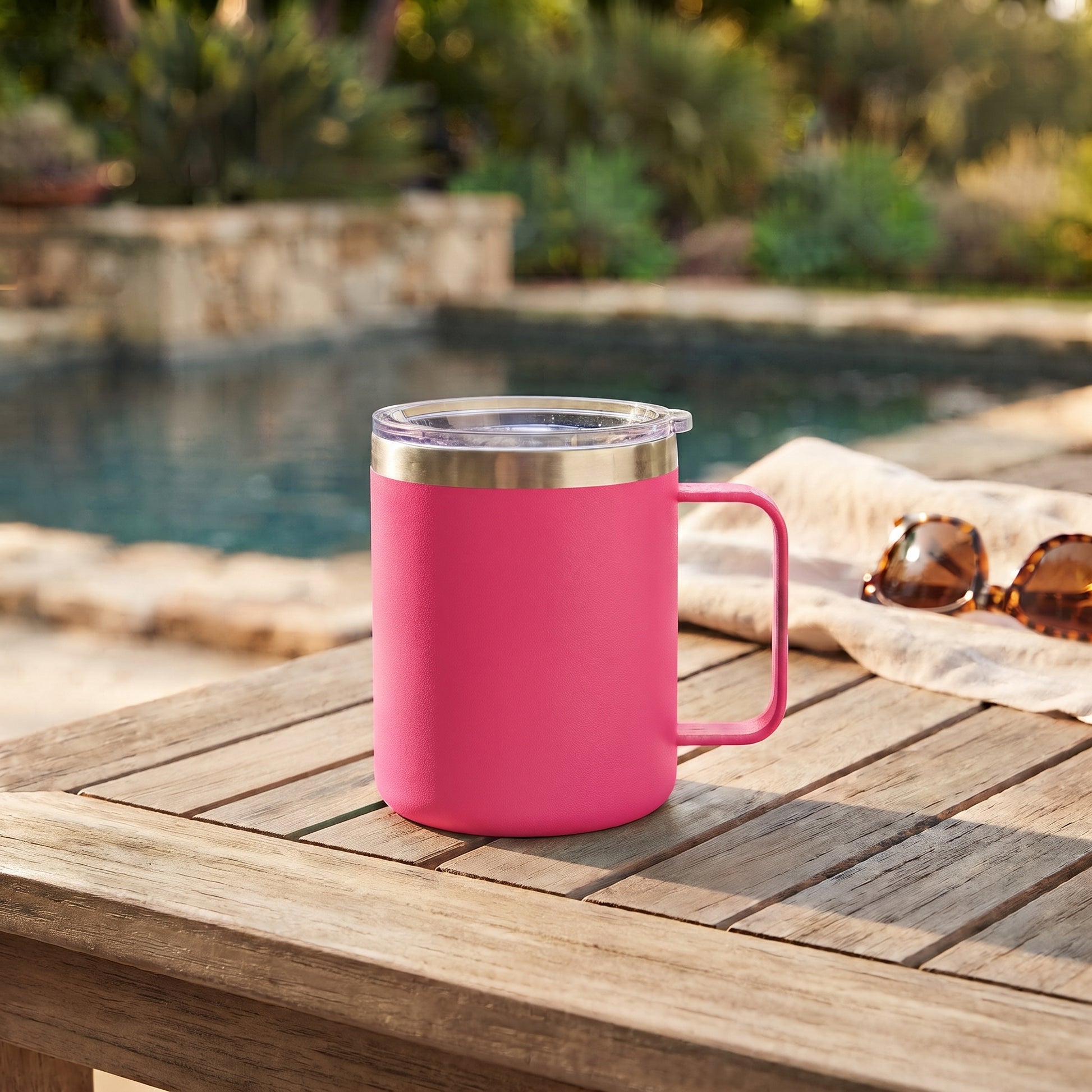 Hot pink 12 oz stainless steel travel mug with handle, vacuum insulation, and leak-proof push-pull lid for hot or cold drinks on the go.
