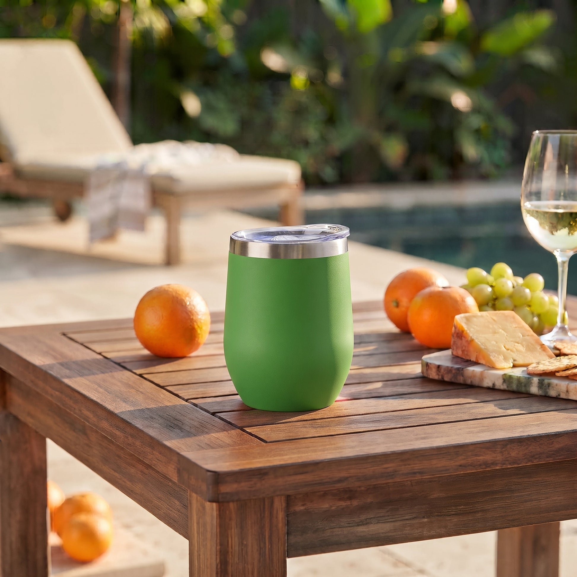 Green 12 oz stainless steel stemless wine tumbler with a compact design for keeping wine or other drinks hot or cold on the go.
