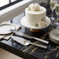 White enamel cake knife and server set with non-tarnish nickel-plated handles, featuring a 13-inch serrated knife and 11-inch serrated server in a silver keepsake gift box.