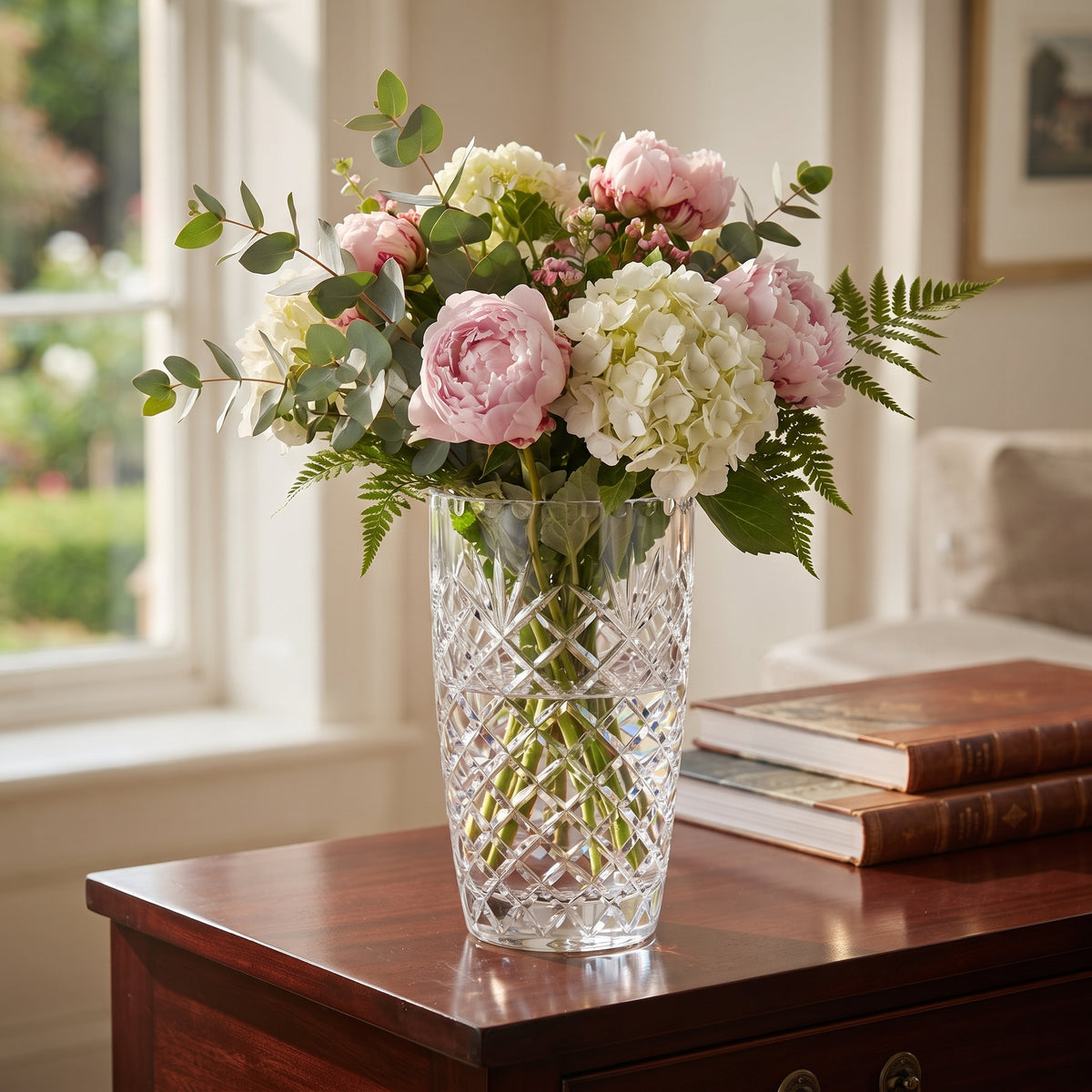 7.75-inch lead-free optic crystal vase with Medallion II pattern, featuring traditional cut crystal detailing and an open area for optional engraving. Gift boxed.