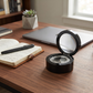 Black round wood box with silver compass, gift boxed.