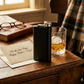 Personalized 6 oz black stainless steel pocket flask with a sleek, compact design and durable construction, making a practical Father's Day gift for dads who enjoy classic drinkware.