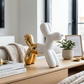White and gold balloon dog bank with electroplated finish, 8.5 inch decorative coin bank featuring modern pop art design for kids' rooms and home décor.
