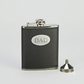 Black leatherette flask with a stainless steel body and engraving plate for a custom engraved design, making it a thoughtful Father's Day gift.