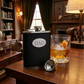 Black leatherette flask with a stainless steel body and engraving plate for a custom engraved design, making it a thoughtful Father's Day gift.