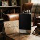 8 oz black stainless steel flask with a silver bottom and integrated lanyard cap, a stylish and practical Father's Day gift for travel, outdoor adventures, or everyday enjoyment.
