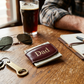 Brown leather money clip, compact minimalist accessory designed for securely holding folded bills and cards, featuring a sleek, durable leather finish, making it a perfect Father’s Day gift for everyday use.