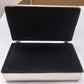 The Rectangular Beaded Edge Lift-Top Jewelry Box with a silver exterior and black velvet interior, displayed open.