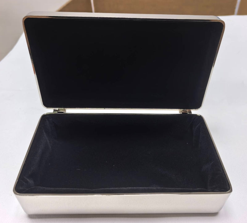 The Rectangular Beaded Edge Lift-Top Jewelry Box with a silver exterior and black velvet interior, displayed open.