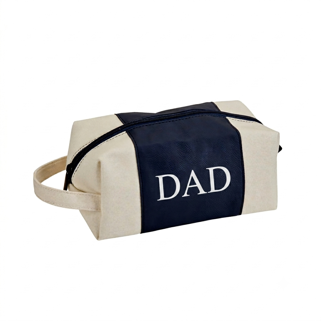 Navy leatherette and canvas travel kit with a classic Dopp kit design, zipper closure, and handle, a practical Father's Day gift for storing travel and grooming essentials.