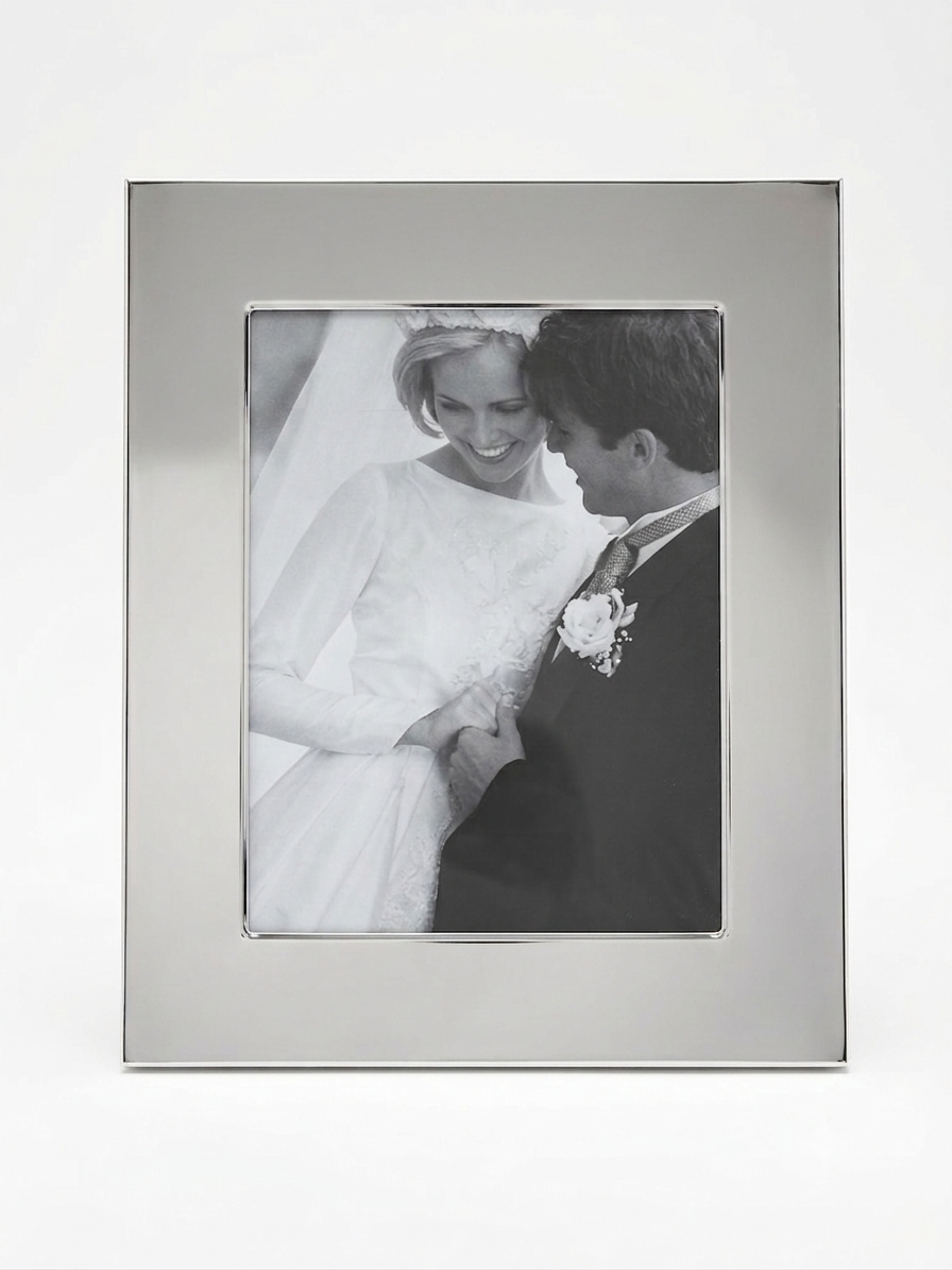 Manchester 8 inch x 10 inch photo frame with a bright metal finish and classic design, perfect for displaying cherished memories in either portrait or landscape orientation.