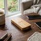 Rectangular bamboo wireless charger with a 10000mAh power bank, measuring 5.75 inch x 2.75 inch, ideal for desk accessories, corporate gifts, and everyday charging.