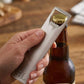 Stainless steel bottle opener with a sleek, slim design and engravable surface. Measures 4.96 inch x 1.13 inch, ideal for home bars, kitchens, weddings, groomsmen gifts, and personalized keepsakes.
