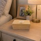 Bamboo wireless phone charger with digital clock, 7.28 x 3.43 x 3.35 inches, featuring wireless charging, an LED display showing time, date, and temperature, adjustable brightness, voice control, and multiple alarm settings.