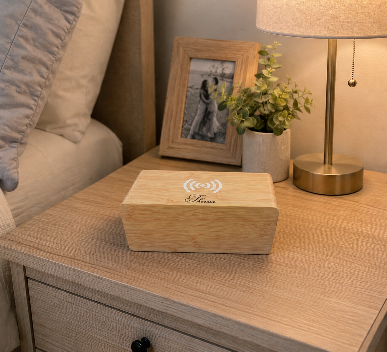 Bamboo wireless phone charger with digital clock, 7.28 x 3.43 x 3.35 inches, featuring wireless charging, an LED display showing time, date, and temperature, adjustable brightness, voice control, and multiple alarm settings.