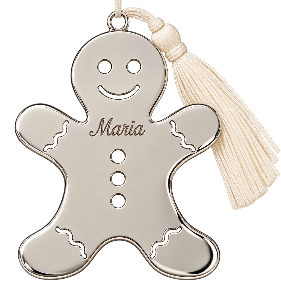 A silver gingerbread ornament with "Maria" engraved on its chest, featuring cutout eyes, a smile, three buttons, and a white tassel.