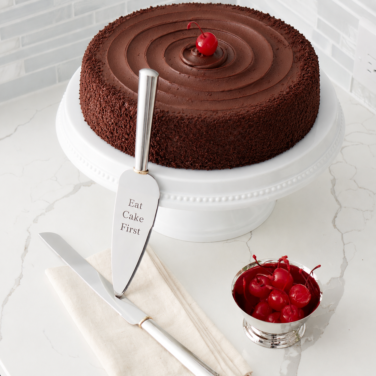 Gold Ring cake knife and server set with non-tarnish nickel-plated finish, featuring gold wedding ring accents, including a 12.75-inch serrated knife and 11-inch serrated cake server in a silver keepsake gift box.