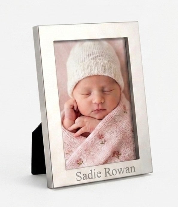 Montauk 4 inch x 6 inch photo frame with a bright metal finish and classic design, perfect for displaying cherished photos and can be personalized for a special touch.